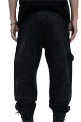 Person wearing black cargo pants on a white background